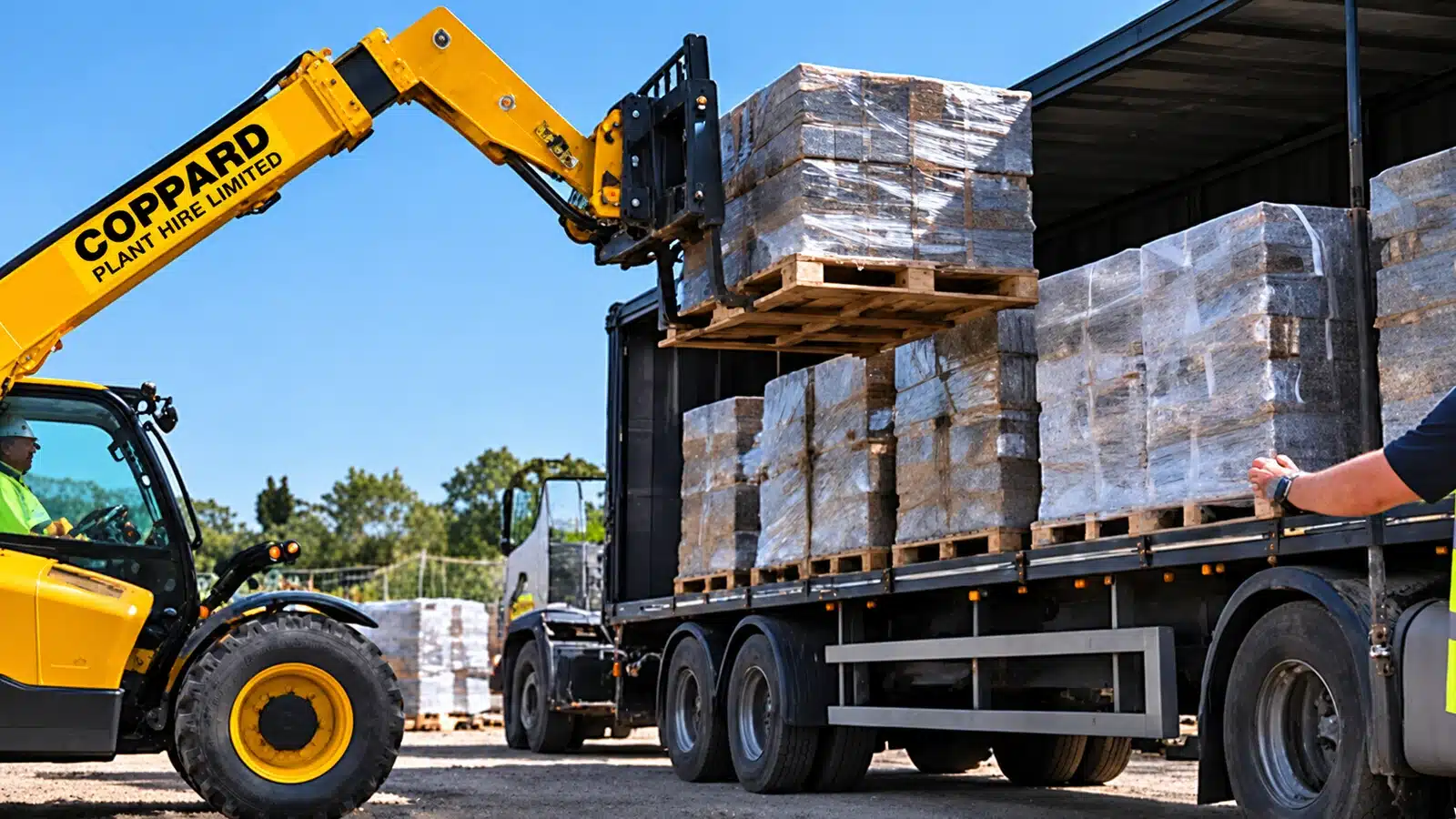 Telehandler unloading building materials